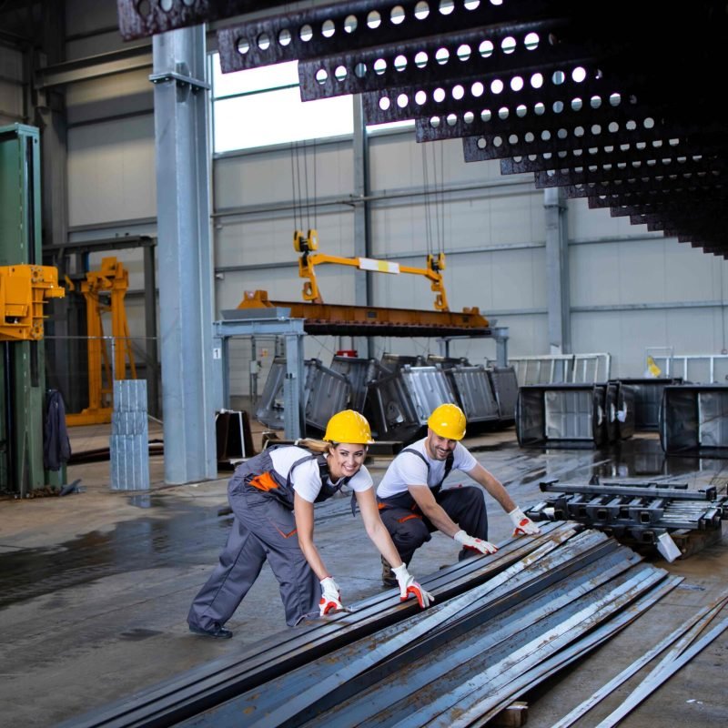factory-workers-handling-metal-parts-together (1)