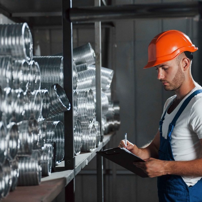 man-in-uniform-works-on-the-production-industrial-2023-11-27-05-28-28-utc (1)